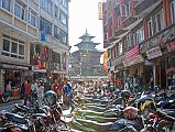 Kathmandu Durbar Square 06 05 Taleju Temple Motorcycles line the street at the north entrance to Kathmandu Durbar Square, with Taleju Temple visible the square.